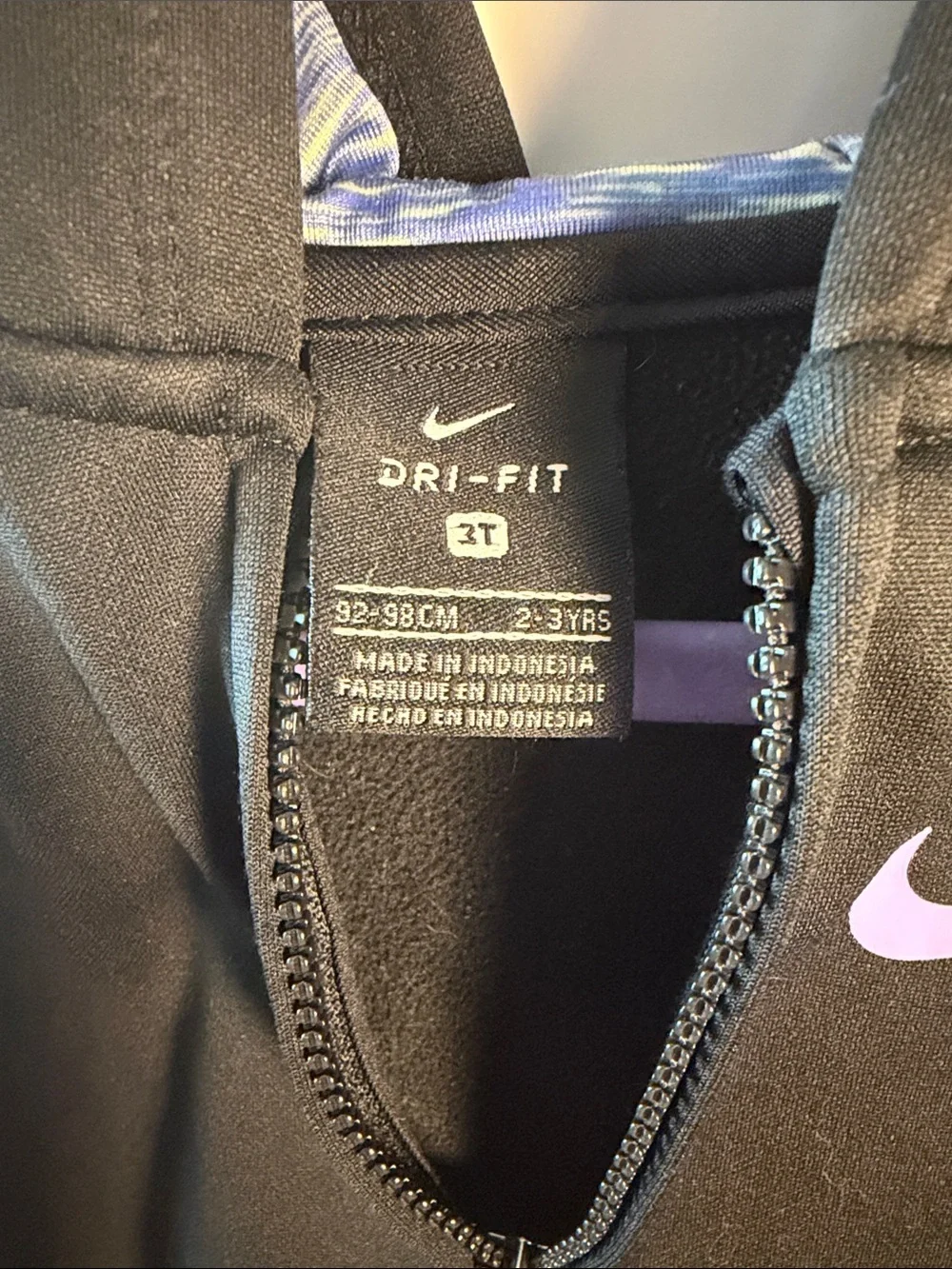 Nike Black Hoodie with Purple Swoosh and Blue/Purple Ruffle along the Bottom